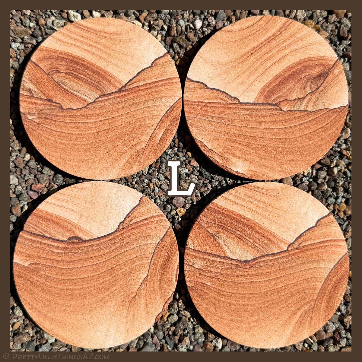 Option L, four coasters with very good scenic pattern, like the sun setting over a desert landscape in a series. Deep red rings appear like the sun, with thin dark iron bands with small scallop pattern creating the landscape features.