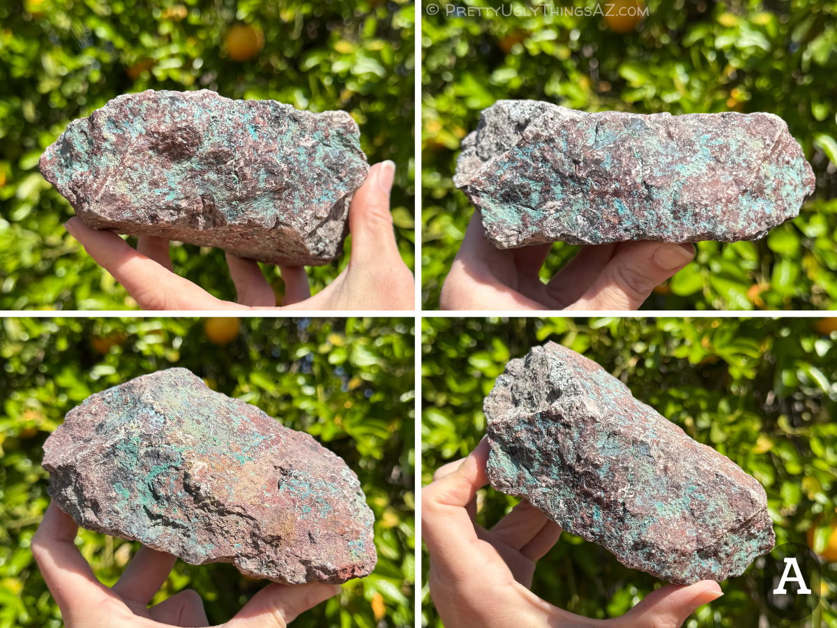 Option A, a roughly rectangular rough piece of granite, dark red-brown with iron oxides. Streaks of green-blue mineral run through it in striking contrast. One side is especially colorful, with shades of red and brown iron oxides and blue-green and green minerals.