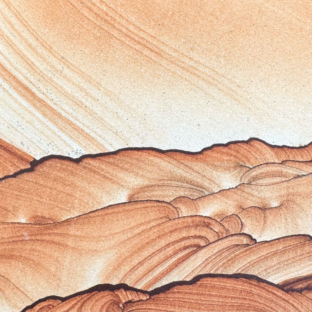 Close detail view of the top dark iron band, the sandstone above it near white with light orange layers sweeping in from the top in a gradient of color like a sunset.
The iron band forms a bold squiggly line like the ridge line of a rocky hill. Thin bands below appear like secondary ridges, with saturated curved layers angled off the iron bands.