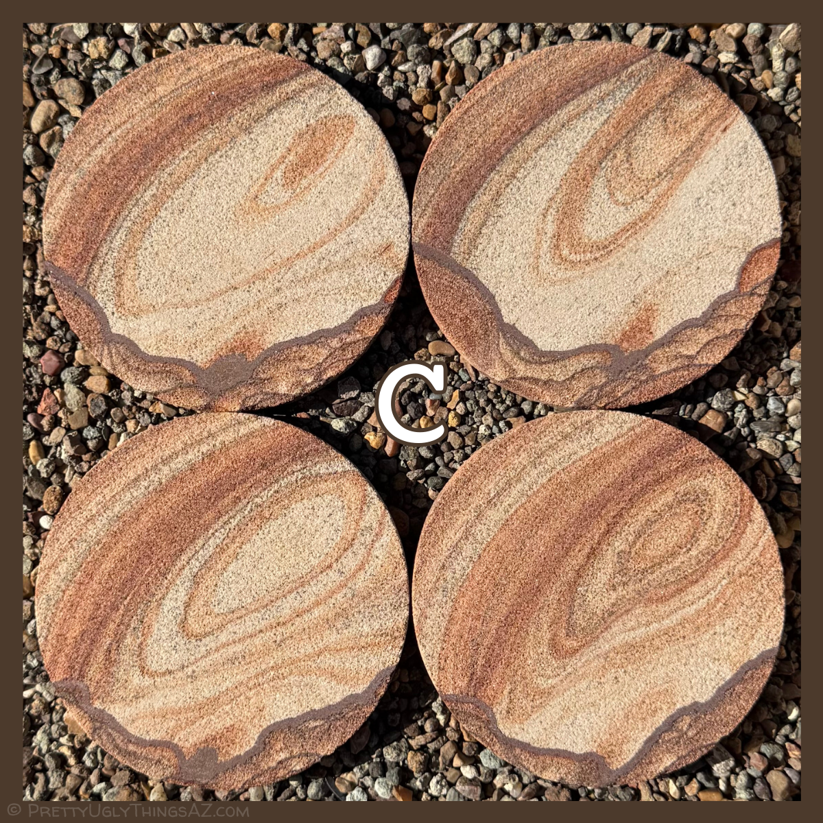 Option C, a lighter-colored set with dark iron banding in scallop pattern along one edge, like a valley with hills on each side. The rest of the coaster has an elongated ringed oval shape that appears to grow larger and darker across each piece.