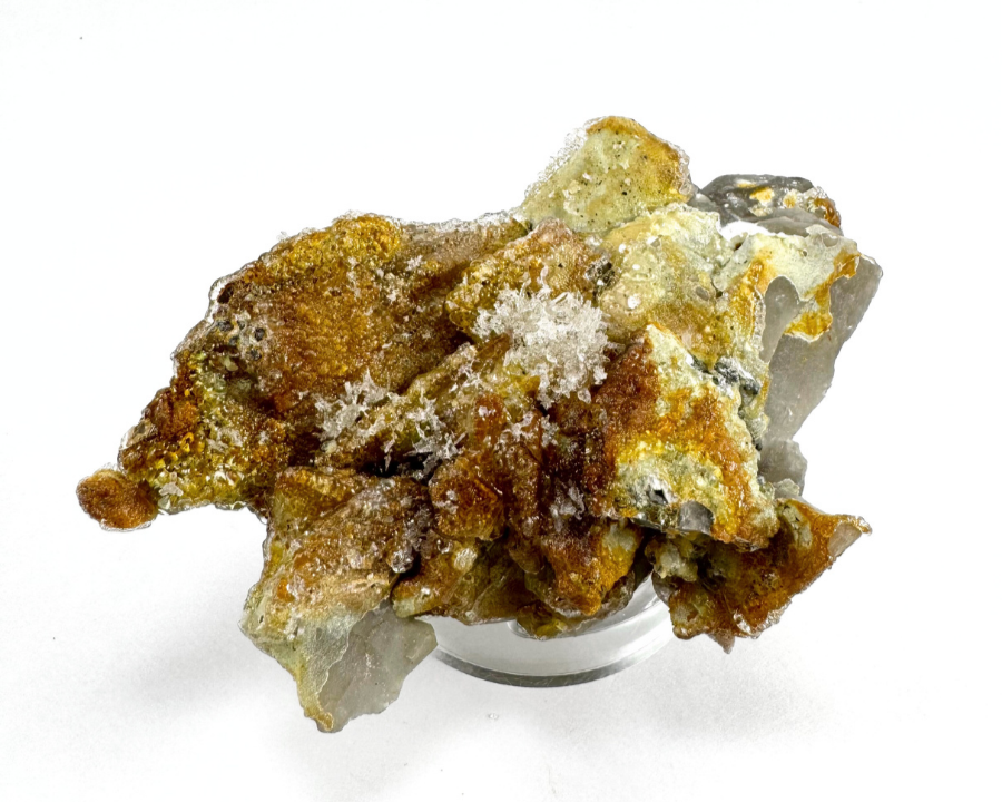 The point in the same position as the previous image, in white light. The underside is a rough clump of flat shards of smoky quartz, almost entirely coated in hyalite with thick growth in areas and a lattice-like formation in the center.