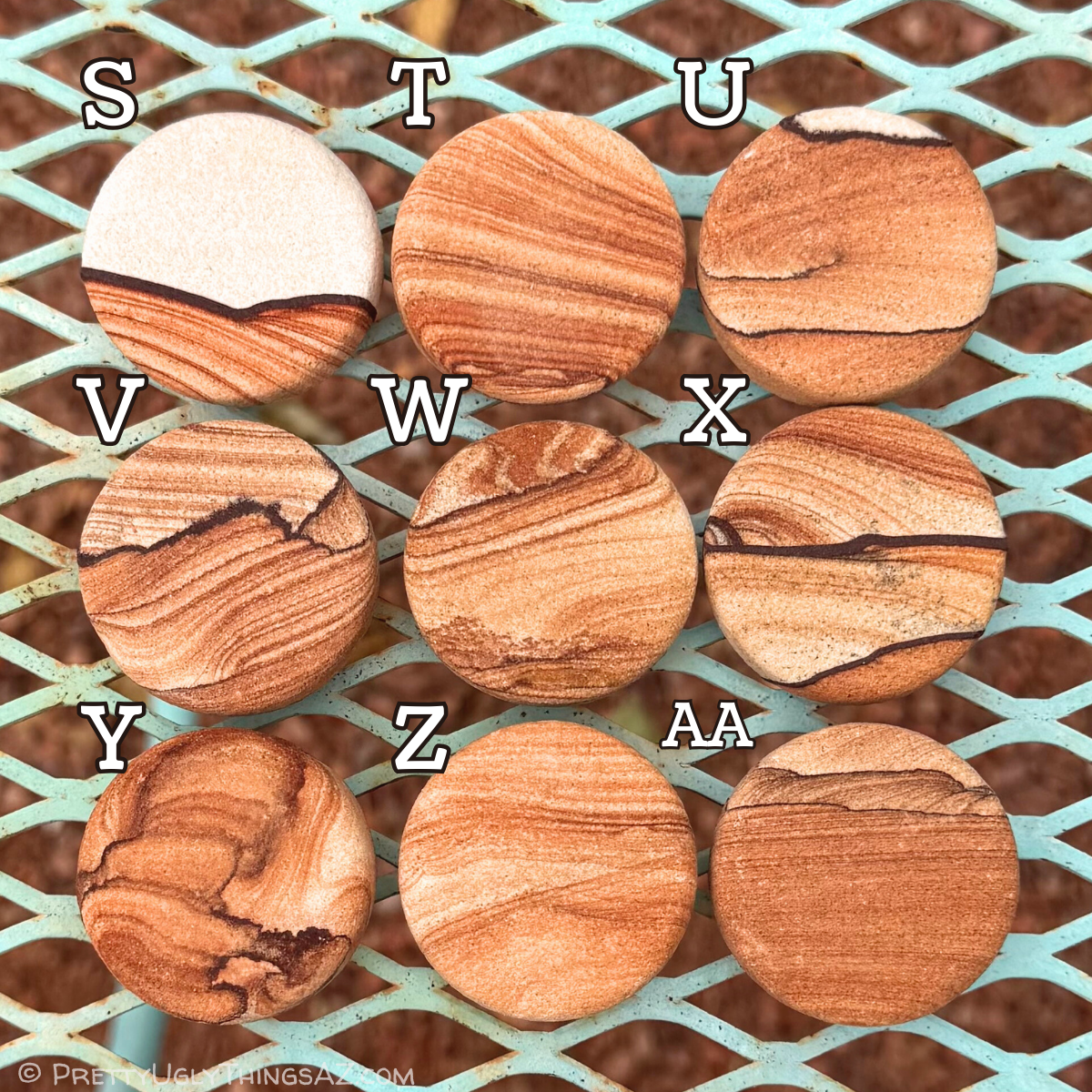 Nine options. Options S, V, W, and X have good picture stone patterns, with S mainly near-white with a bold iron band and vivid pattern on one side. The others look like a sky over a desert landscape, option X having the boldest pattern. Option T has straight layering that starts to curve, with option Z similar but lighter toned. Option Y is dark and splotchy with rings. Option U has light layering, a few thin dark bands, and a white edge. Option AA has thin dense layers, with light scalloping like hills.