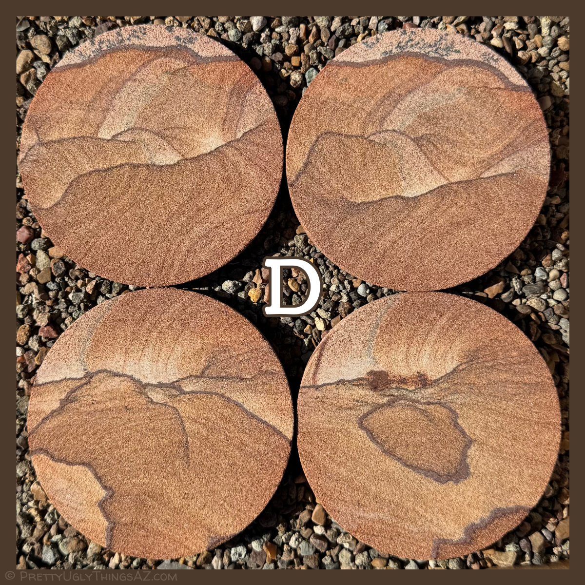 Option D, a set with more even tone, some thin dark bands snaking across the surface with curved layering coming off them, forming hill-like patterns. Two of the pieces have a dark iron band along the edge, with different rock on the other side of it that contains iron dendrites.