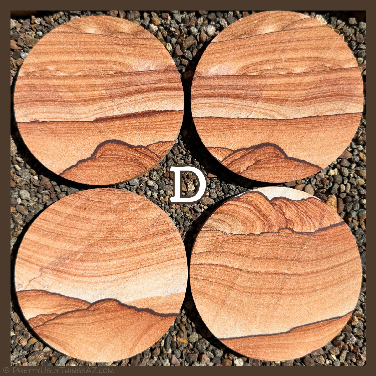 Option D, four coasters with a hill-like shape formed by a dark iron band and deeper red layering at the bottom. There is more even horizontal layering above, with light spots in it.