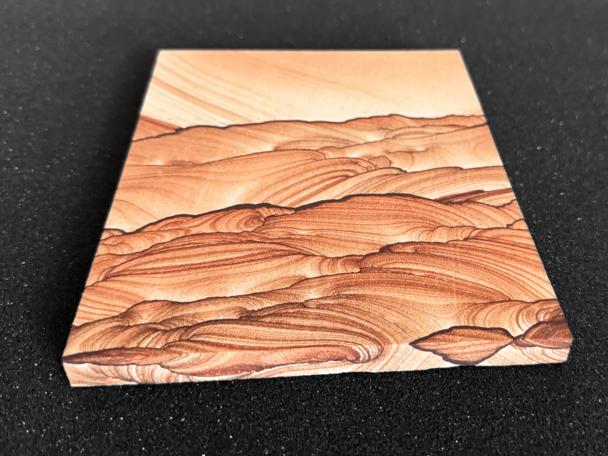 Angled view looking up from the base of the slab, showing the edge is about a centimeter thick.