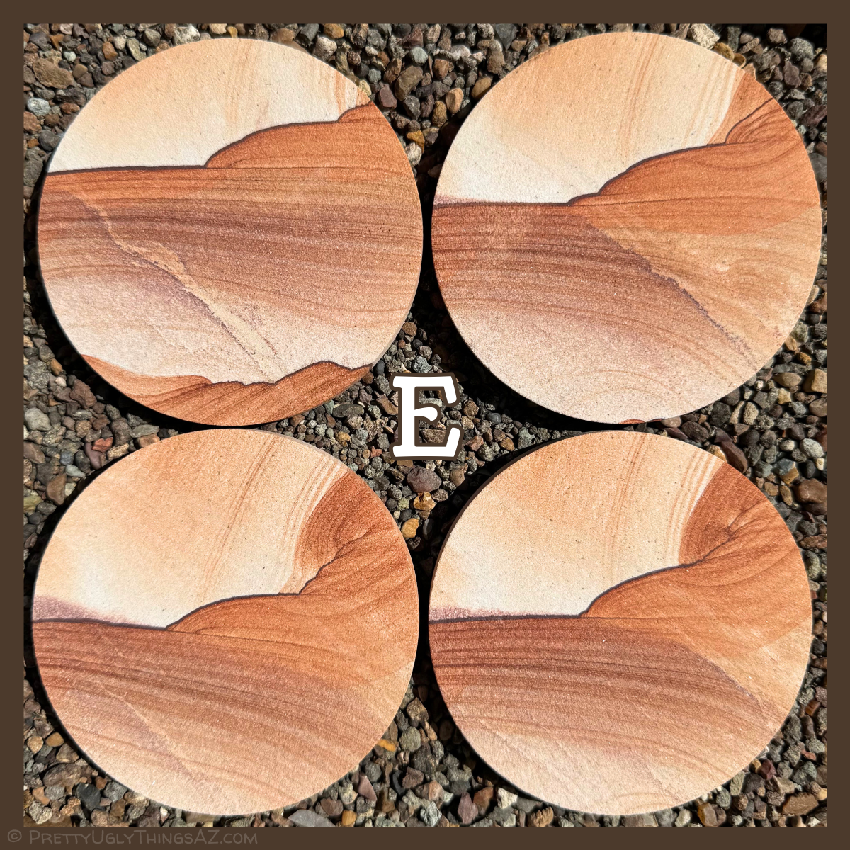 Option E, four coasters with lighter color, each about one-third near-white with only light layering. A dark iron band cuts across this with scalloped pattern, red layers sweeping off it. Part of the layering is a warm orange-red, and part a deeper brick red.