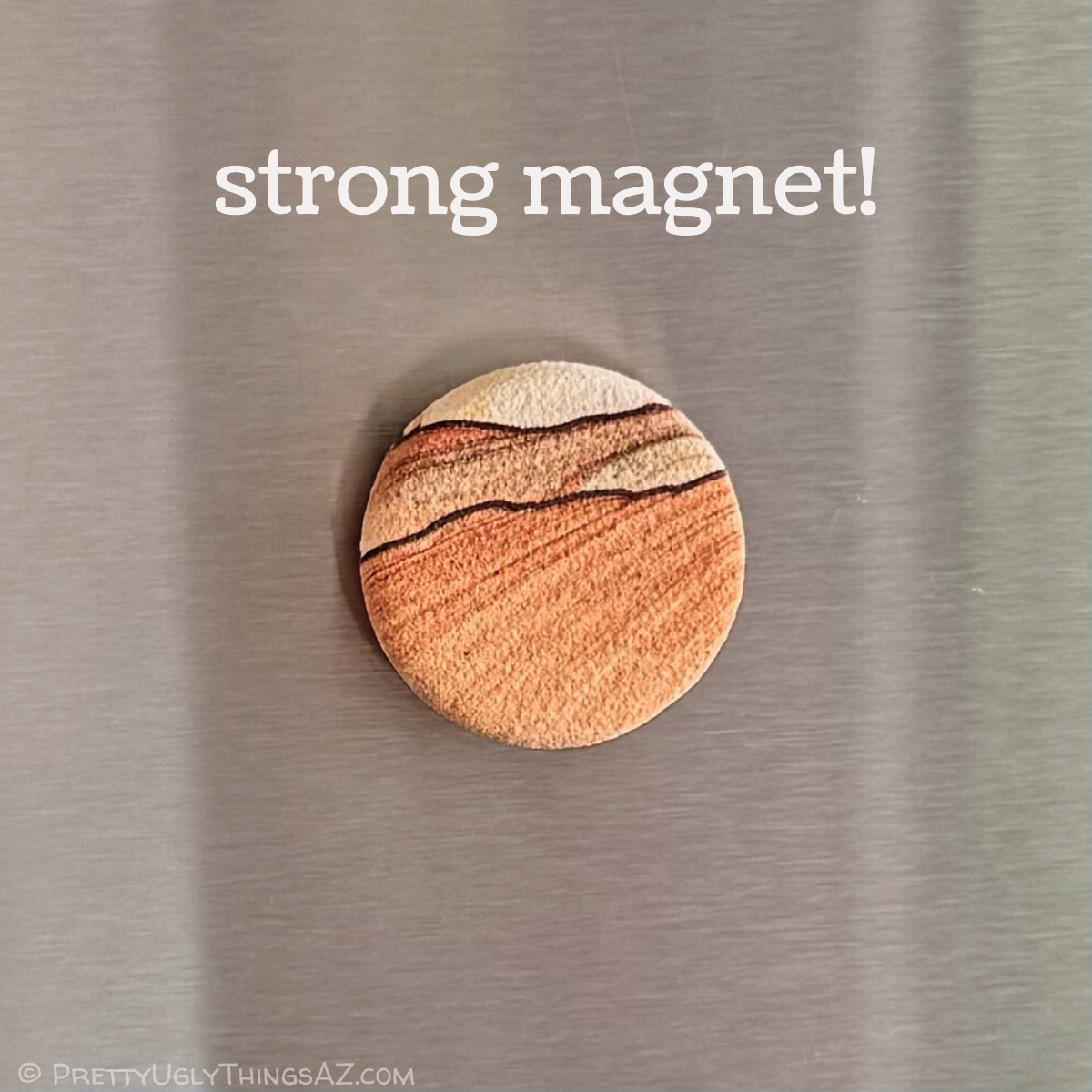 One of the magnets on stainless steel, captioned strong magnet!