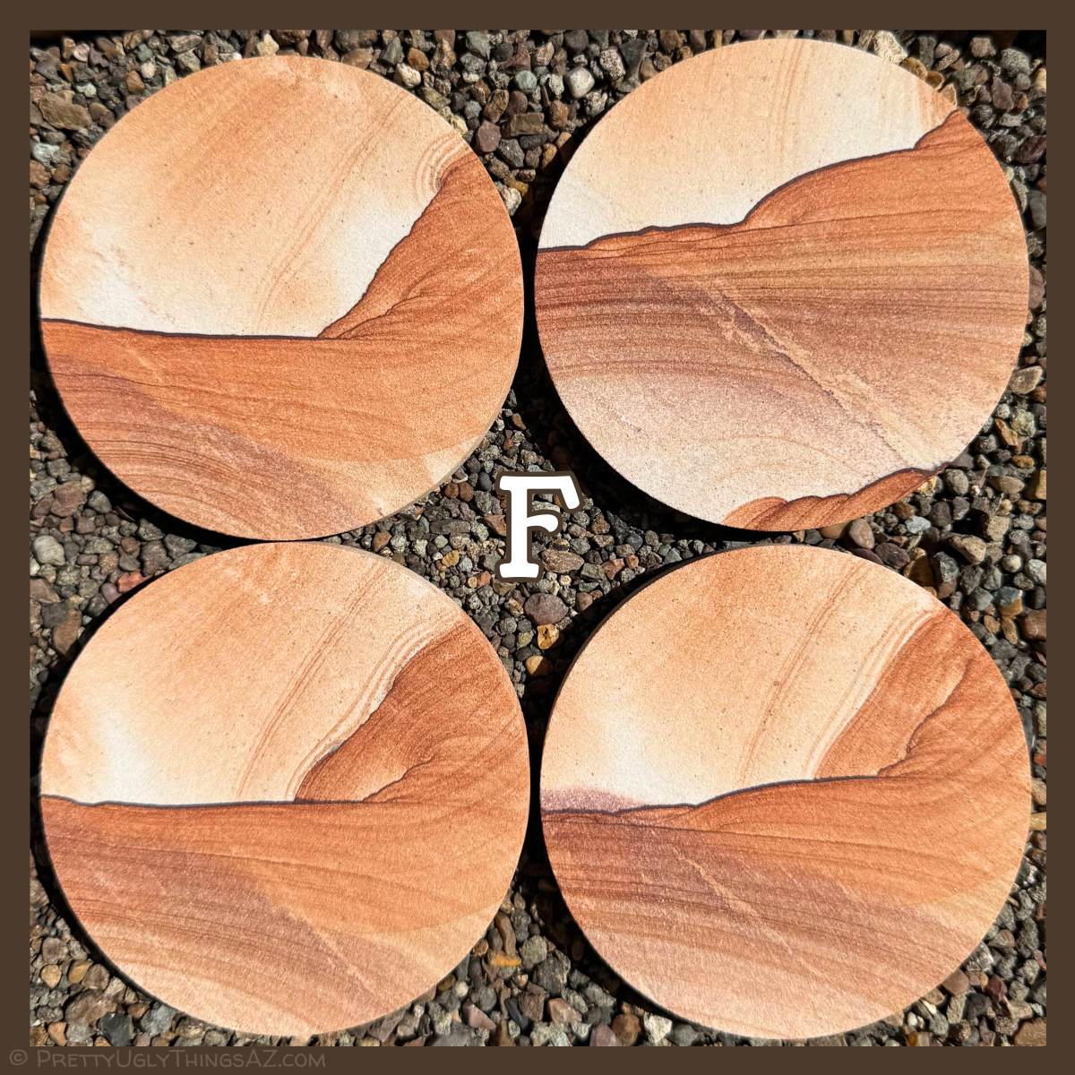 Option F, four coasters with lighter color, each about one-third near-white with only light layering. A dark iron band cuts across this with scalloped pattern, red layers sweeping off it below and with a sun-like formation in one corner. Part of the layering is a warm orange-red, and part a deeper brick red.