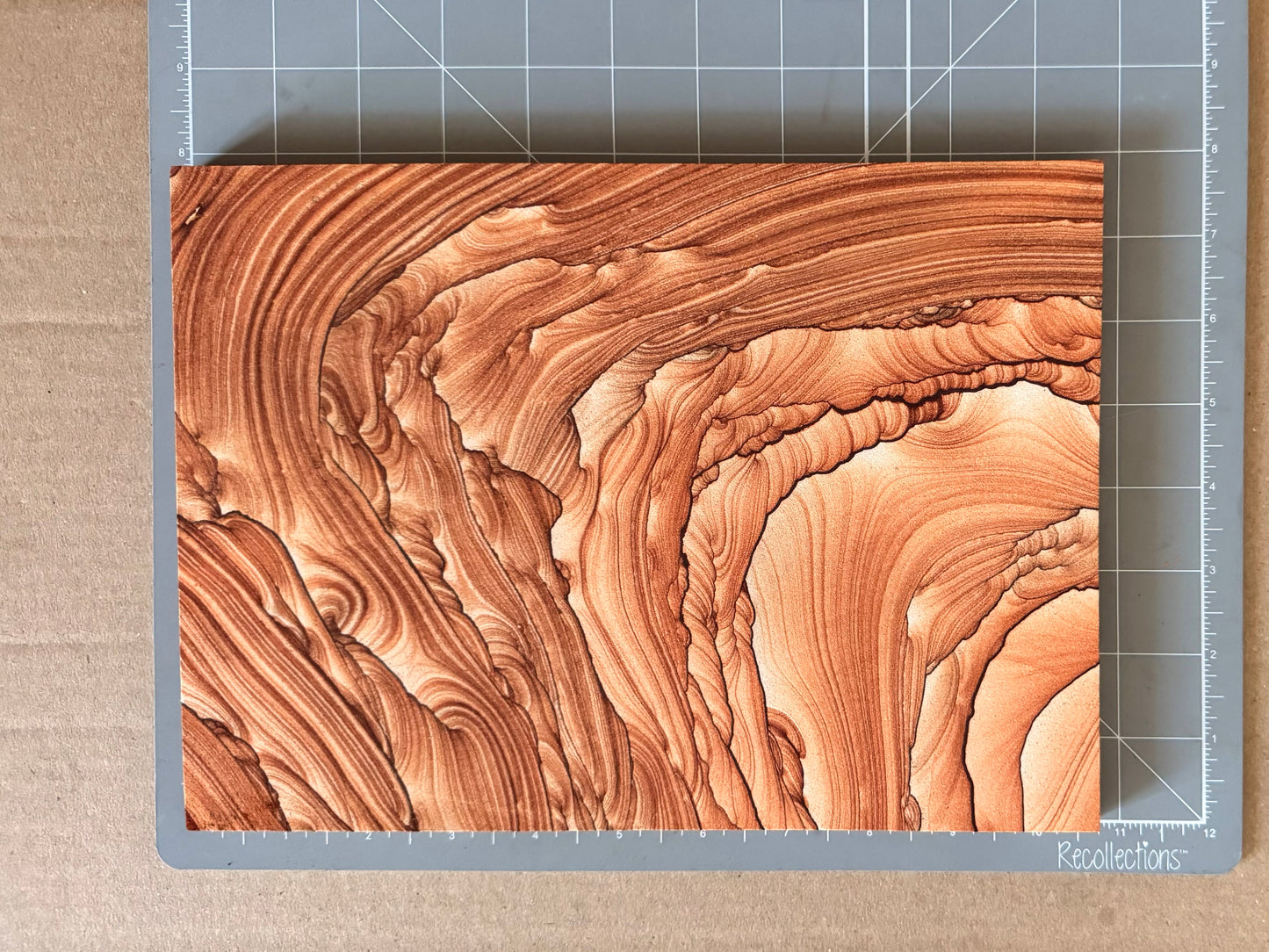 Scale image of the piece on a measuring mat, measuring a bit over ten and a half inches long and seven and a half inches wide.