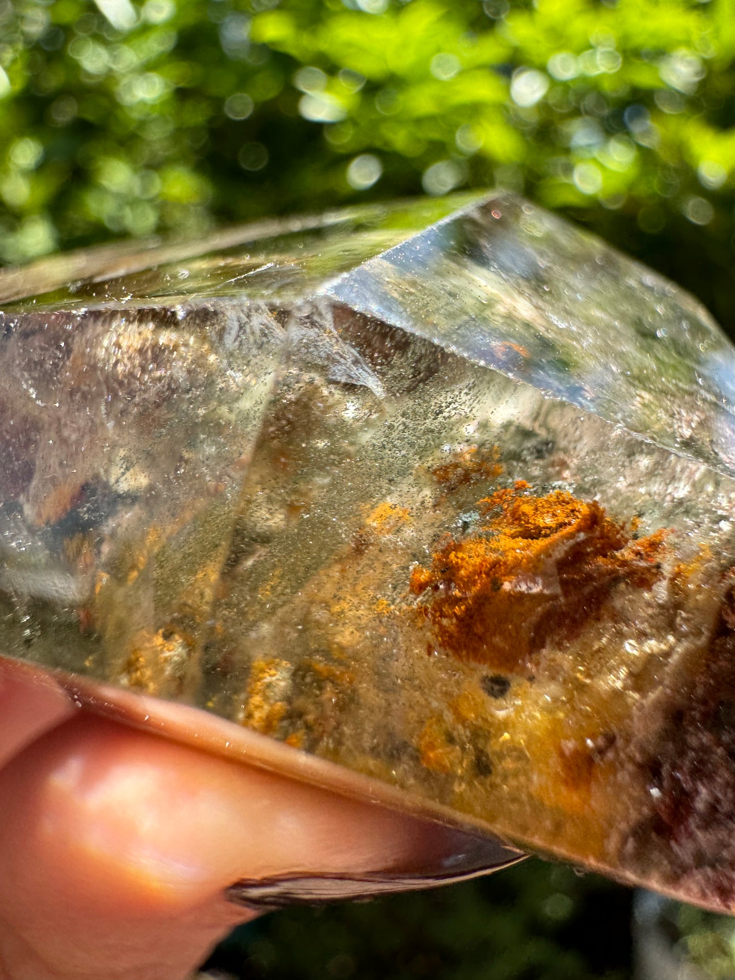 Detail of a round orange chlorite inclusion, with a fine layer of green spots near it