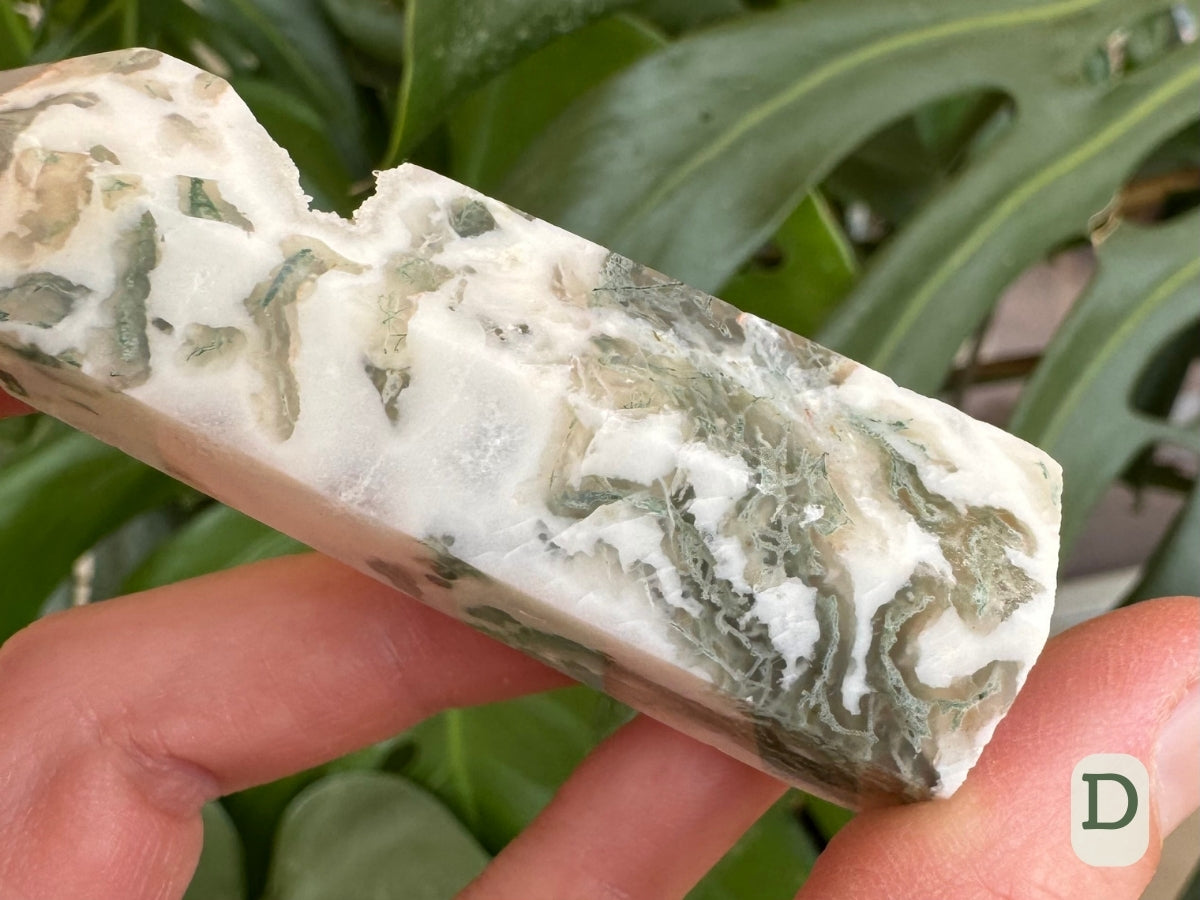 Option D, detail of the base showing the texture of the moss agate, light mint green mossy inclusions in veins of translucent agate through the white agate.