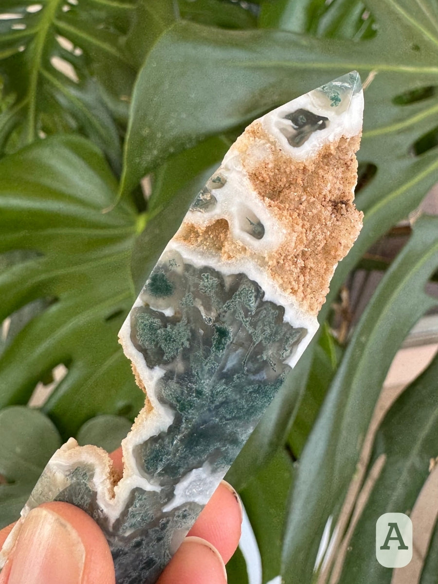 Detail of the tip of the tower, with good mossy pattern and small pockets of green in translucent chalcedony.
