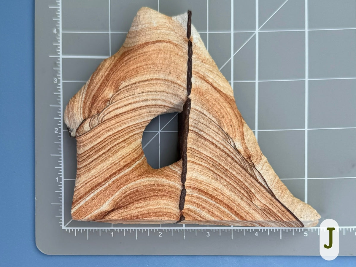 Scale image of option J, about four inches tall by four and a half inches wide.