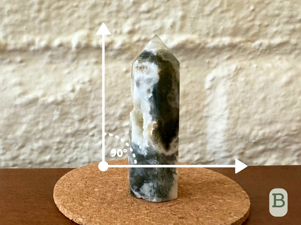 Option B, the tower on a flat surface with a right angle showing it is close to straight