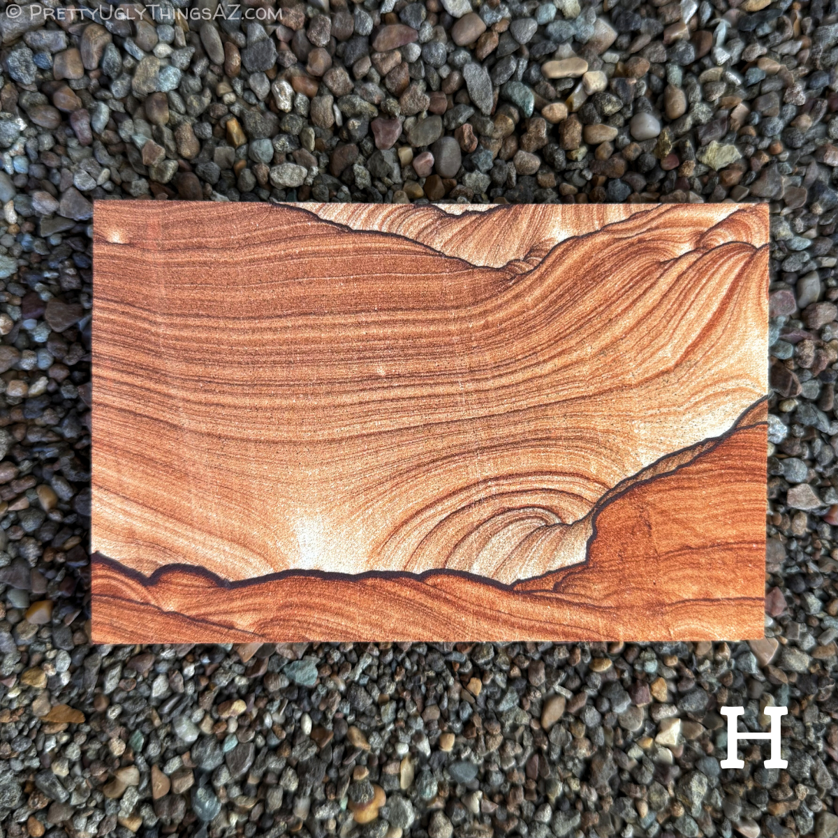 Option H, a standard rectangle with very good pattern, darker red-brown thin layers curve across the piece, with a bold dark iron band running across the bottom, like a landscape with broad sky over it. Below the line is a deeper red-orange color, and above is near white in a gradient deepening to darker brown-red. There is some scallop pattern in the upper right.