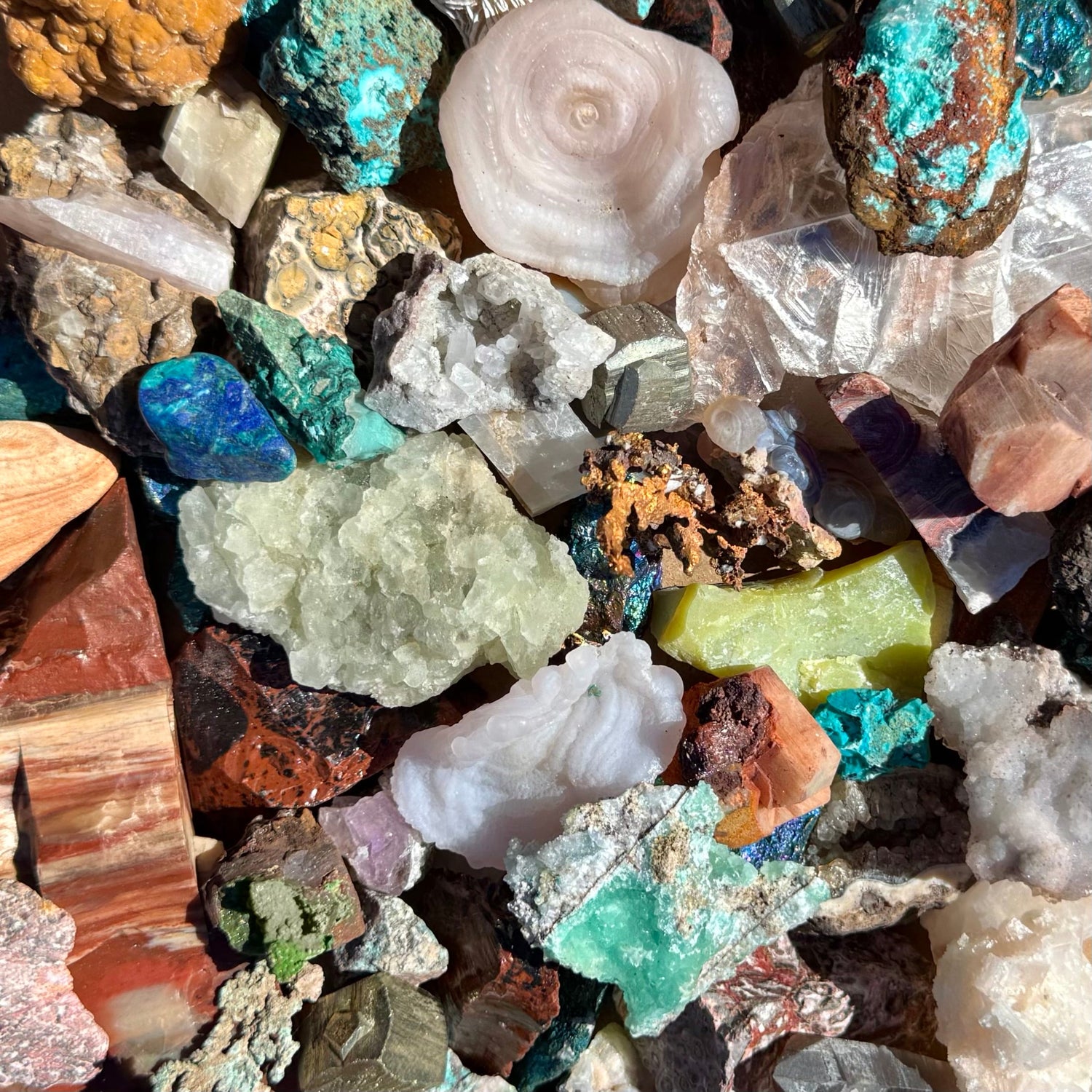 A mixture of different minerals from the southwest, heavy on red-brown and blue-green colors.