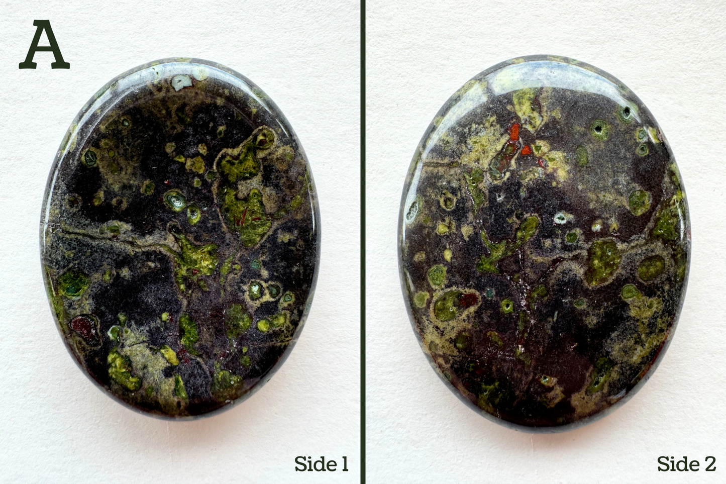 Option A, a dark gray color with spots of lime green borders by dark gray and then a greenish-tan. There are a few small red spots, and some good veining pattern.