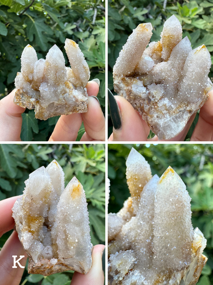 Option K, four images of a cluster of cactus quartz with four tall, thinner crystals coated in fine druzy. The quartz is white with a small amount of yellow staining in interesting patterns on several point tips.