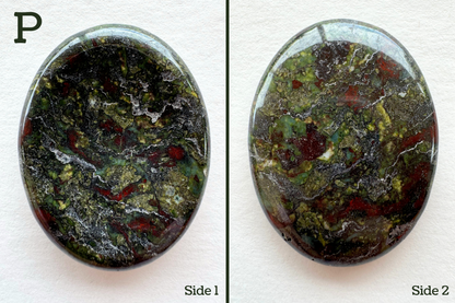 Option P, chaotic but colorful with pattern of lime green, blue-green, and red with a grainy gray background. The inverted side has a lot of surface veins that are slightly indented.