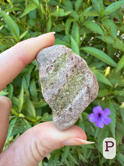 Option P, a five-layered rock alternating a light pink-gray tinted rock with two layers of softer greenish material, which was eroded more quickly making the surface corrugated