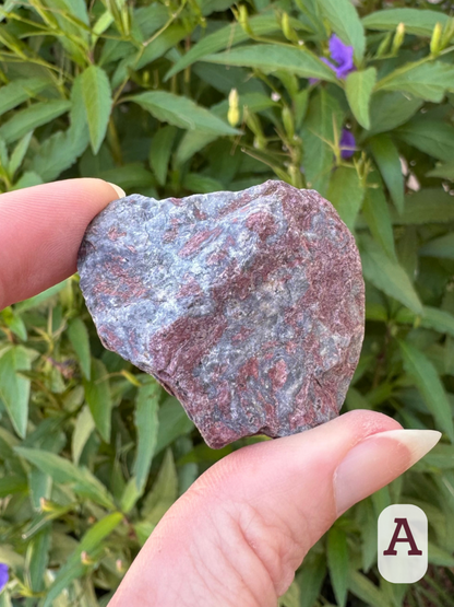 Option A, irregular-shaped rock with a mottled blue-gray and maroonish colors