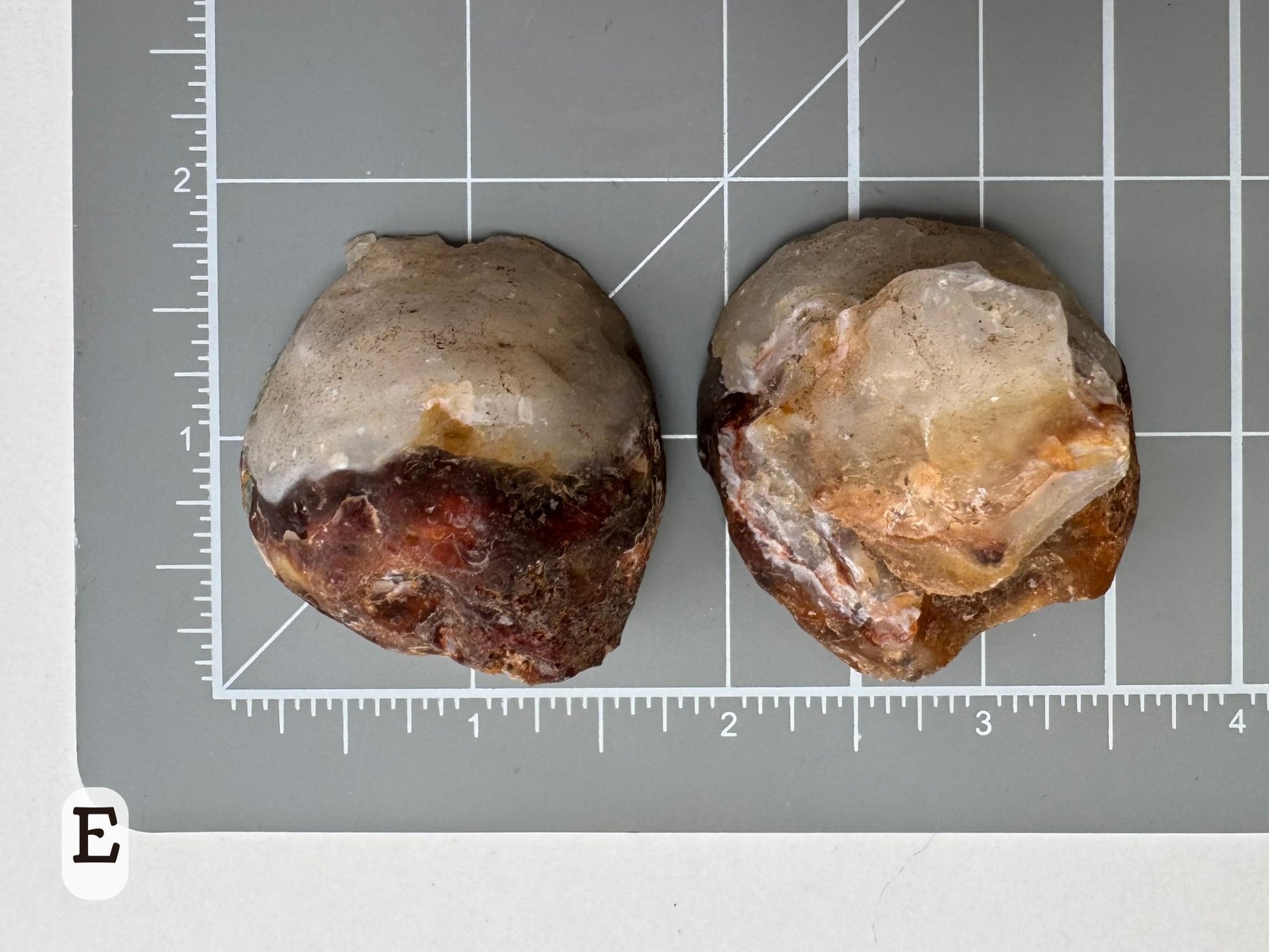 Option E: Scale image of the geode pair face-down on a measuring mat, measuring about an inch and a half in diameter.