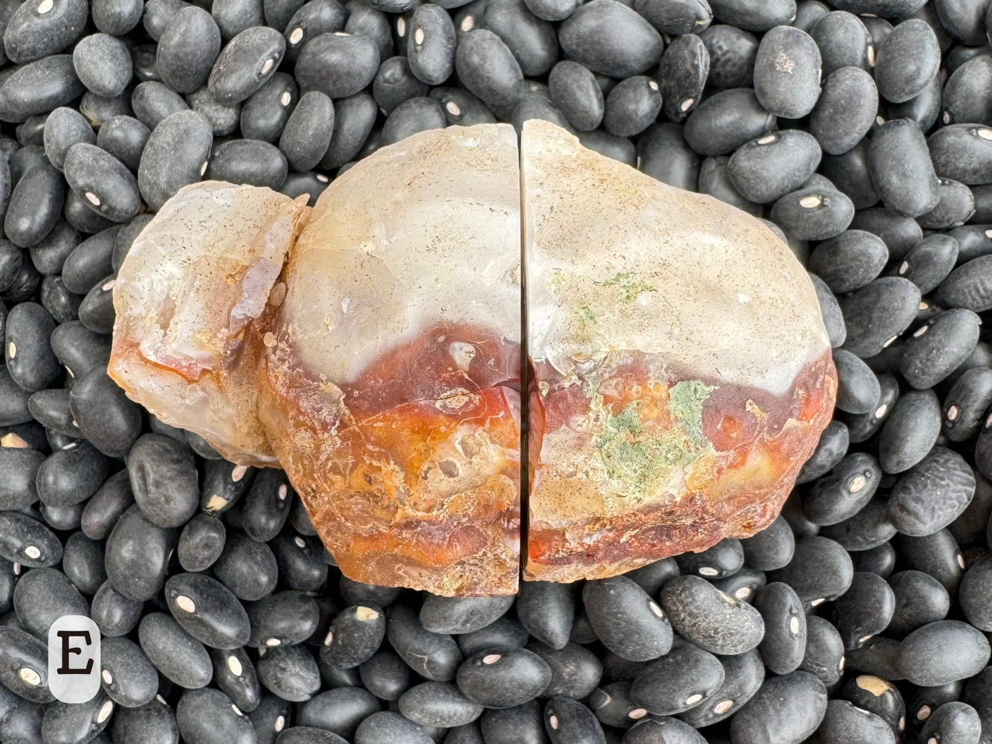 Option E, the geode composed showing the outside, with chalcedony separated into white on top and dark red-brown and orange below