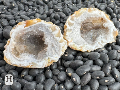 Option H: off-round geode pair, light colored with a feather agate edge of white and light brown, and a colorless quartz interior.