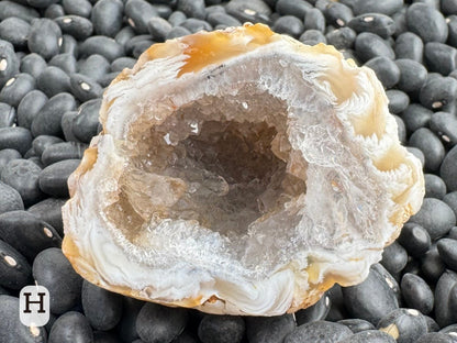 Option H: Detail of the other half of the geode, with lighter blonde brown and white feathering and glittering colorless druzy inside.