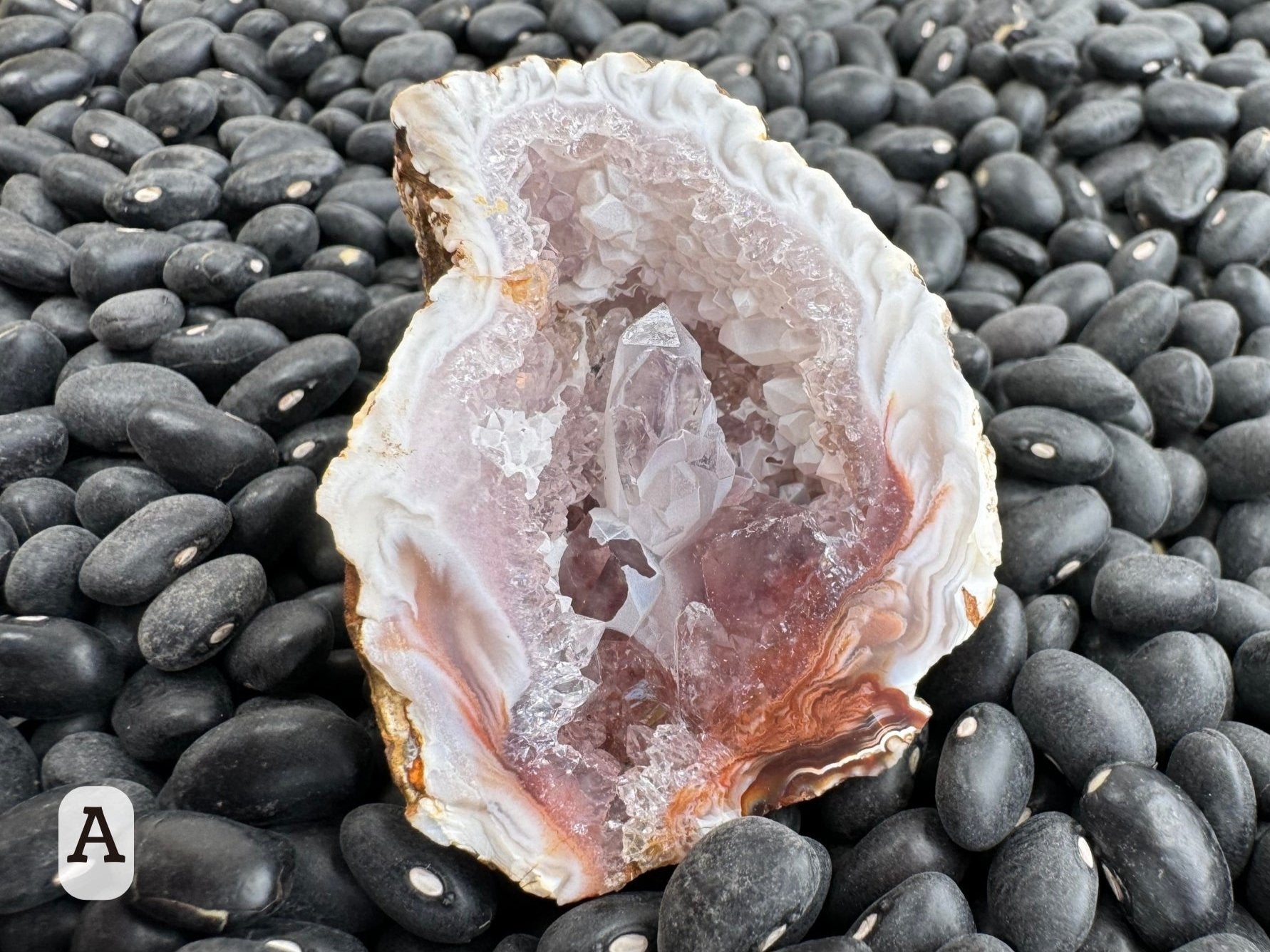 Option A: Detail of the other half of the geode, with a cluster of larger quartz crystals in the center and partially covered with a sugary white overgrowth layer.