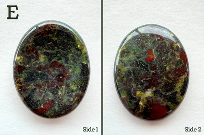 Option E, a dark grainy green-gray base color with lime green and red spots. The lime looks as though blue color is mixing into it. There is a white spot with yellow-green near it.