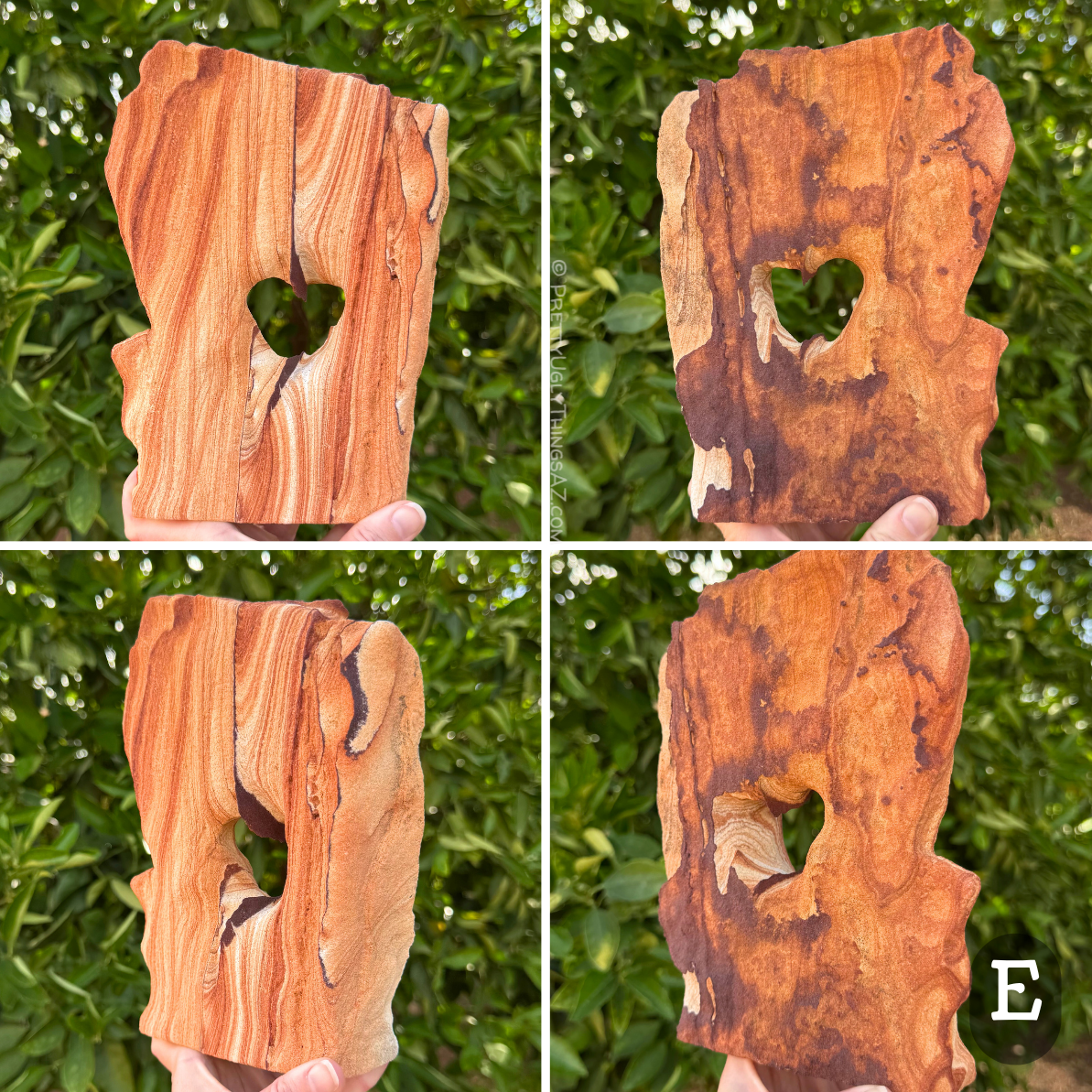 Option E, a broad flat arch shaped like a tablet with an angled top. A thin dark iron band runs down the middle of the face, making the hole in the middle heart-shaped. One face of the arch has excellent high-contrast layering, with deep red-orange to light cream layers. The other face is nearly totally covered with dark iron banding in a flat layer on the surface,  blotchy dark brown to orange-red color.