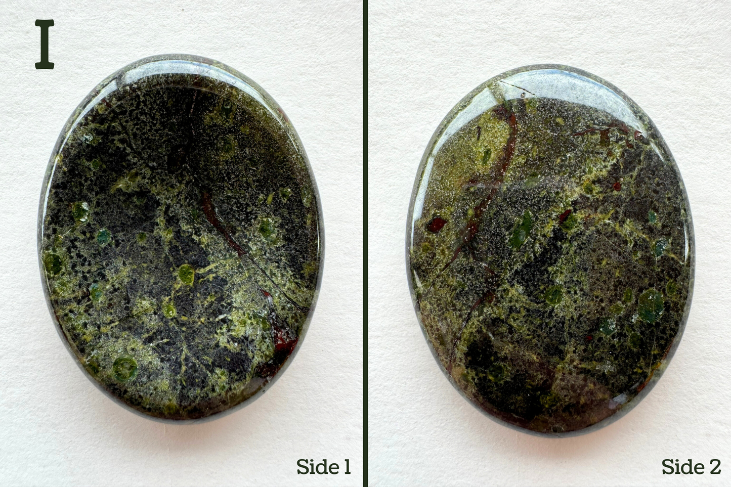 Option I, a grainy base color with bands of darker gray and lighter lime tinted color. It has several colorful crystals embedded in it and seen in cross-section, with saturated lime-green and blue-green coloration. There are some dark red spots and thin veining