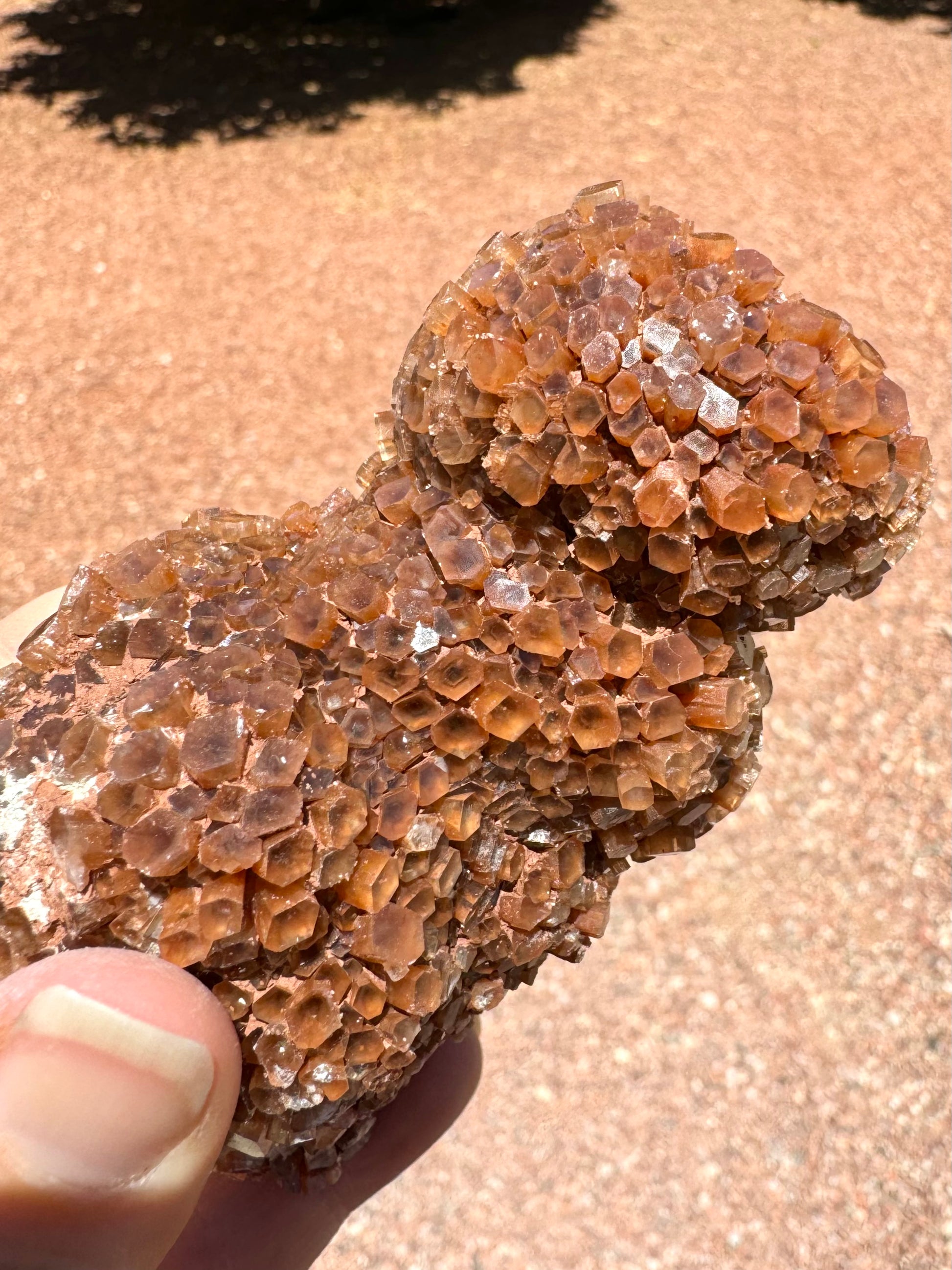 A detail view of the side, with clear-to translucent color coloring visible within some of the crystals.