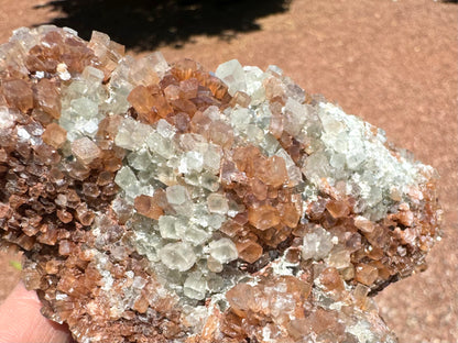 Detail of mixed white and red-brown crystals, some taller well-formed crystals.