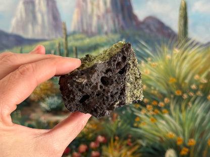 An end of the piece with plain volcanic rock with bubble holes, and peridotite visible on two sides