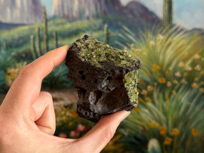 And irregular side of the piece with large bubble holes in the volcanic rock and peridotite on the top and right sides.