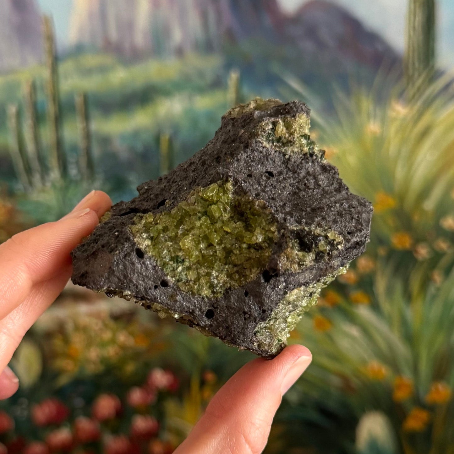 A side of the piece with focus on the gemmy patch of peridotite primarily composed of olivine.