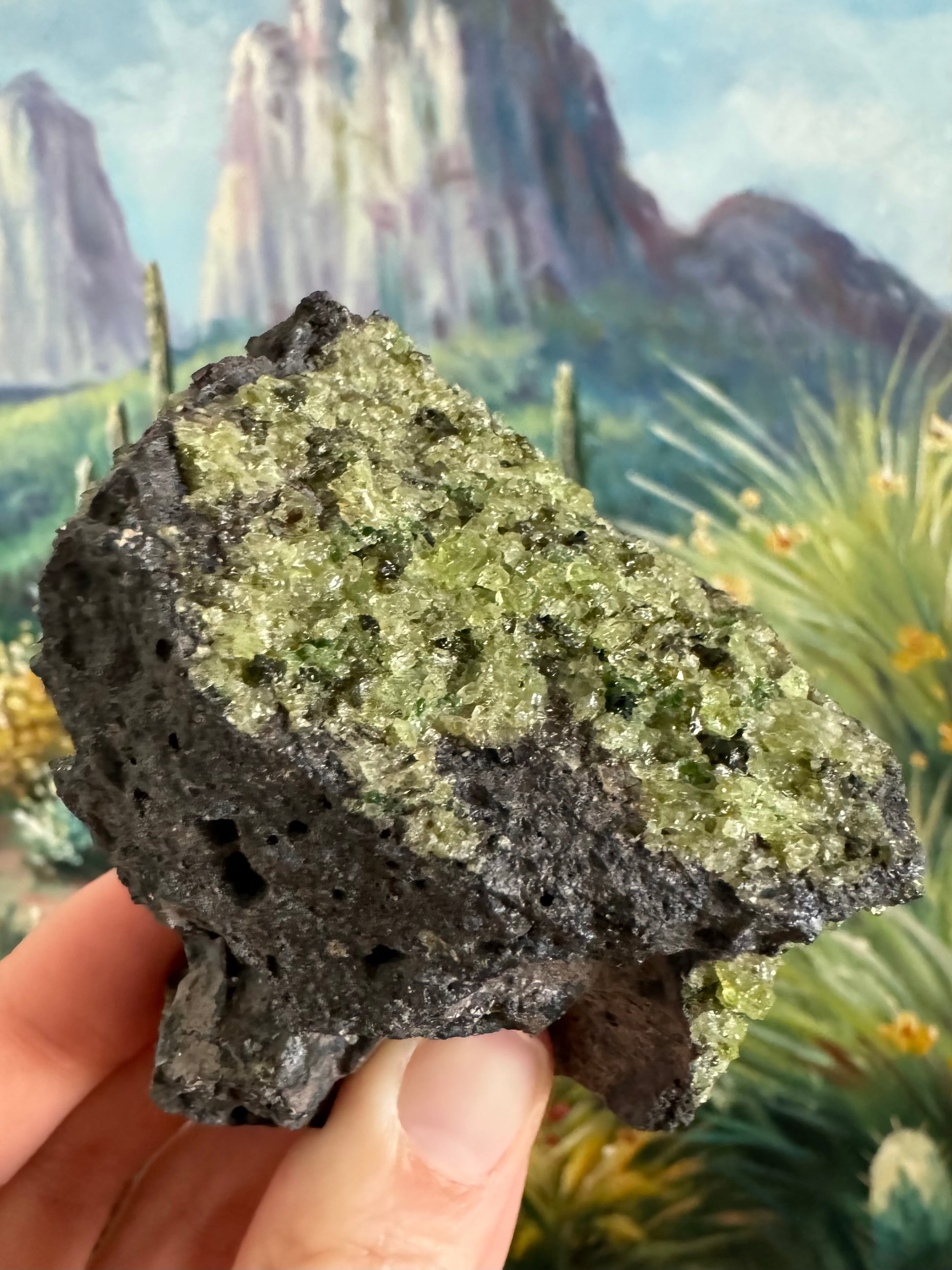 Detail view of the patch of desaturated yellow-green peridotite crystals, some with dark green spinel and diopside crystals mixed in.