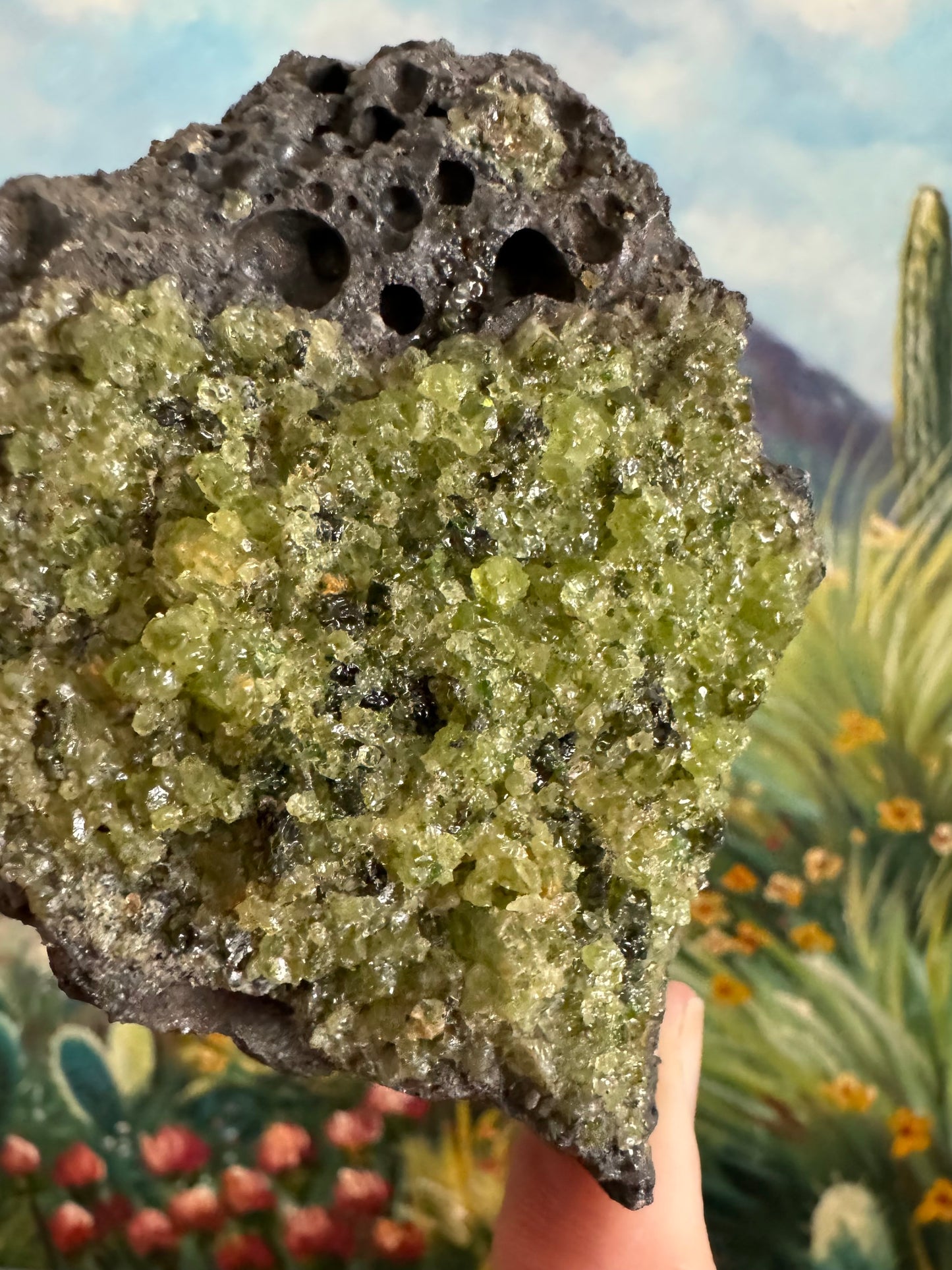 Detail of the gemmy peridotite with medium-sized crystal grain of olivine and some darker crystals in the mix.