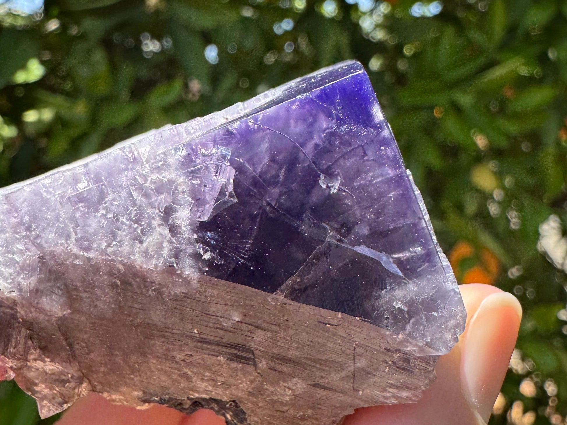Detail view of the intense violet color in a corner of the piece, with the interior appearing more of desaturated purple.