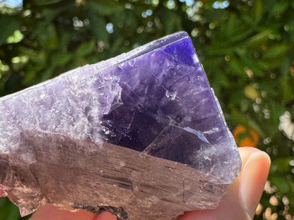 Detail view of the intense violet color in a corner of the piece, with the interior appearing more of desaturated purple.