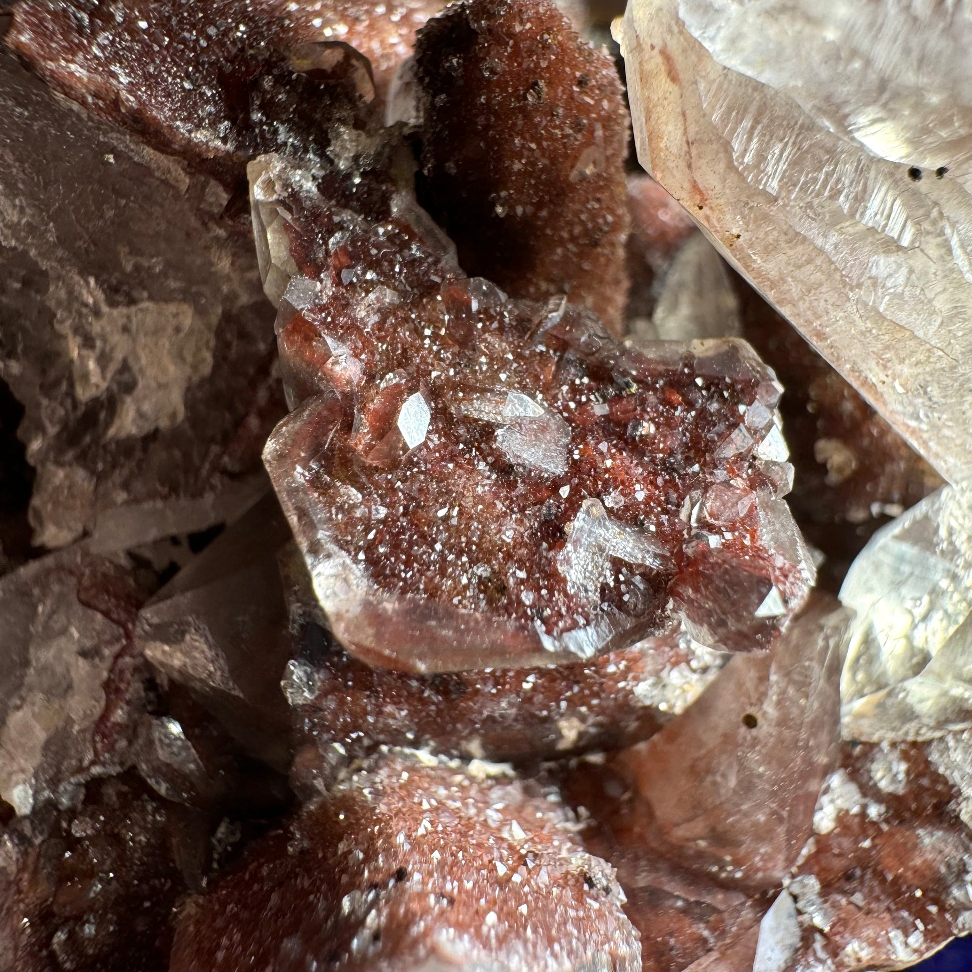 Detail of the unusual structure with a bowl-like colorless quartz filled with red druzy, with small colorless quart crystals on top.