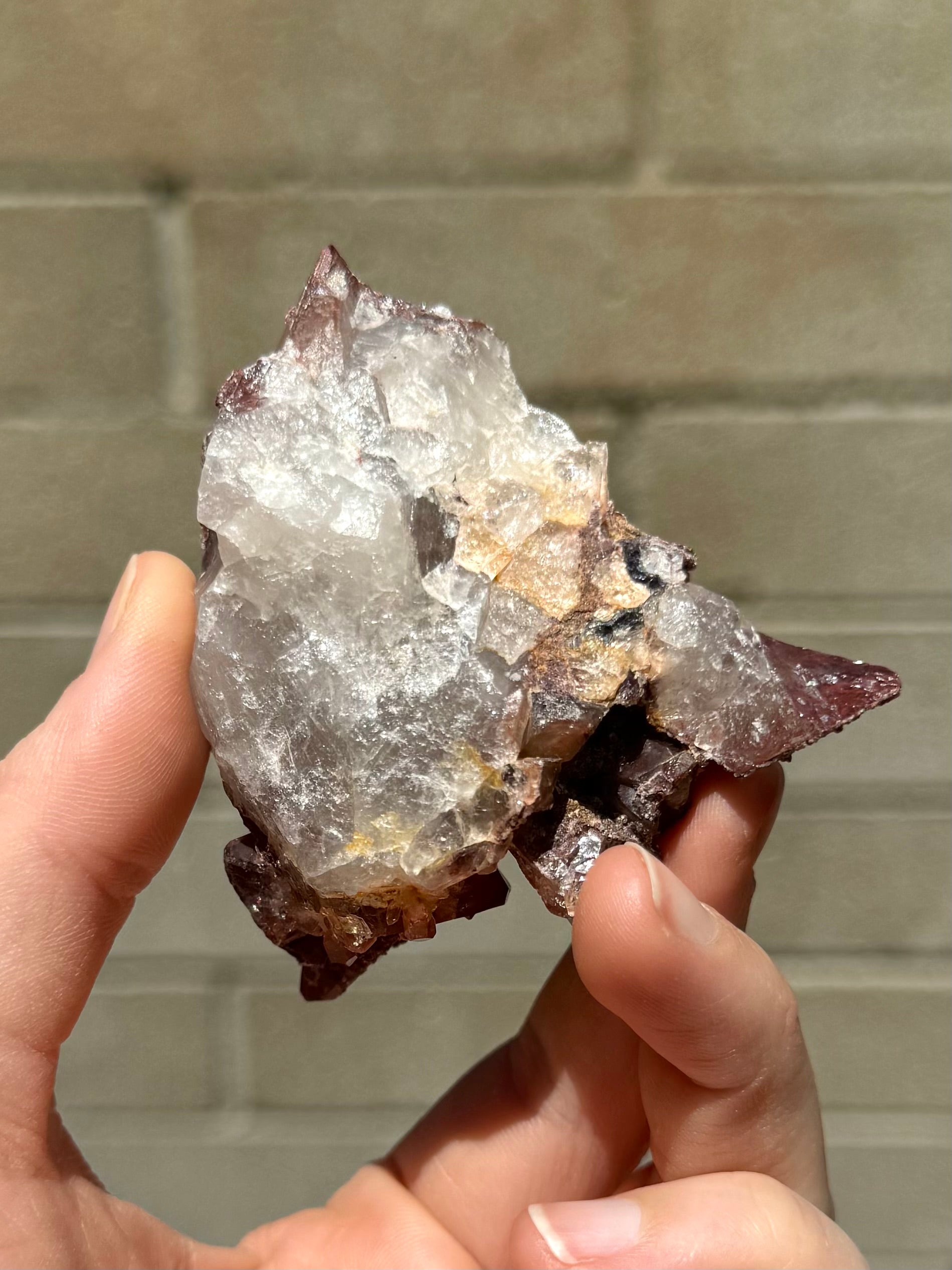 The underside of the specimen, a rough white semi-opaque quartz aggregate.