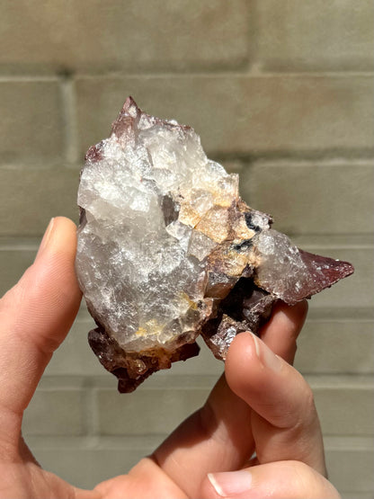 The underside of the specimen, a rough white semi-opaque quartz aggregate.