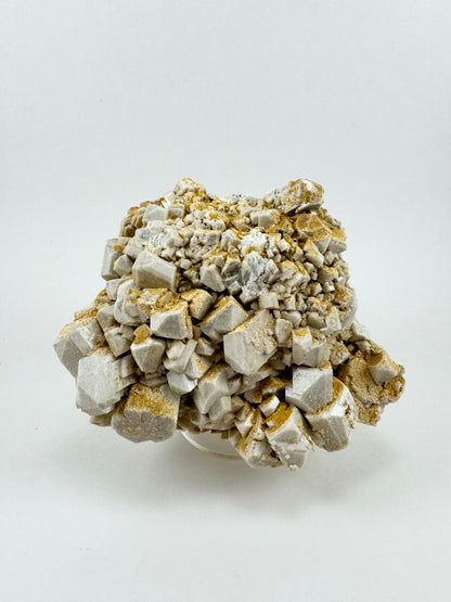 Full view of the piece from a different angle looking whiter, with the siderite less visible.