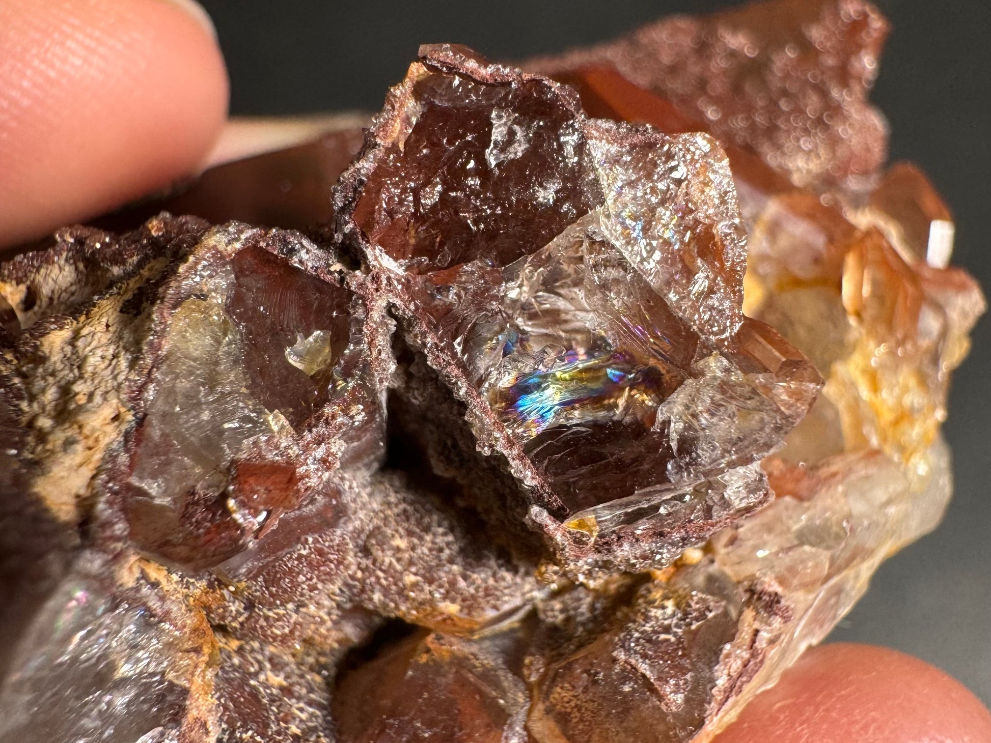 Detail of broken quartz crystal ends on the piece, showing good hexagonal growth and with one producing a rainbow in the fractured end.