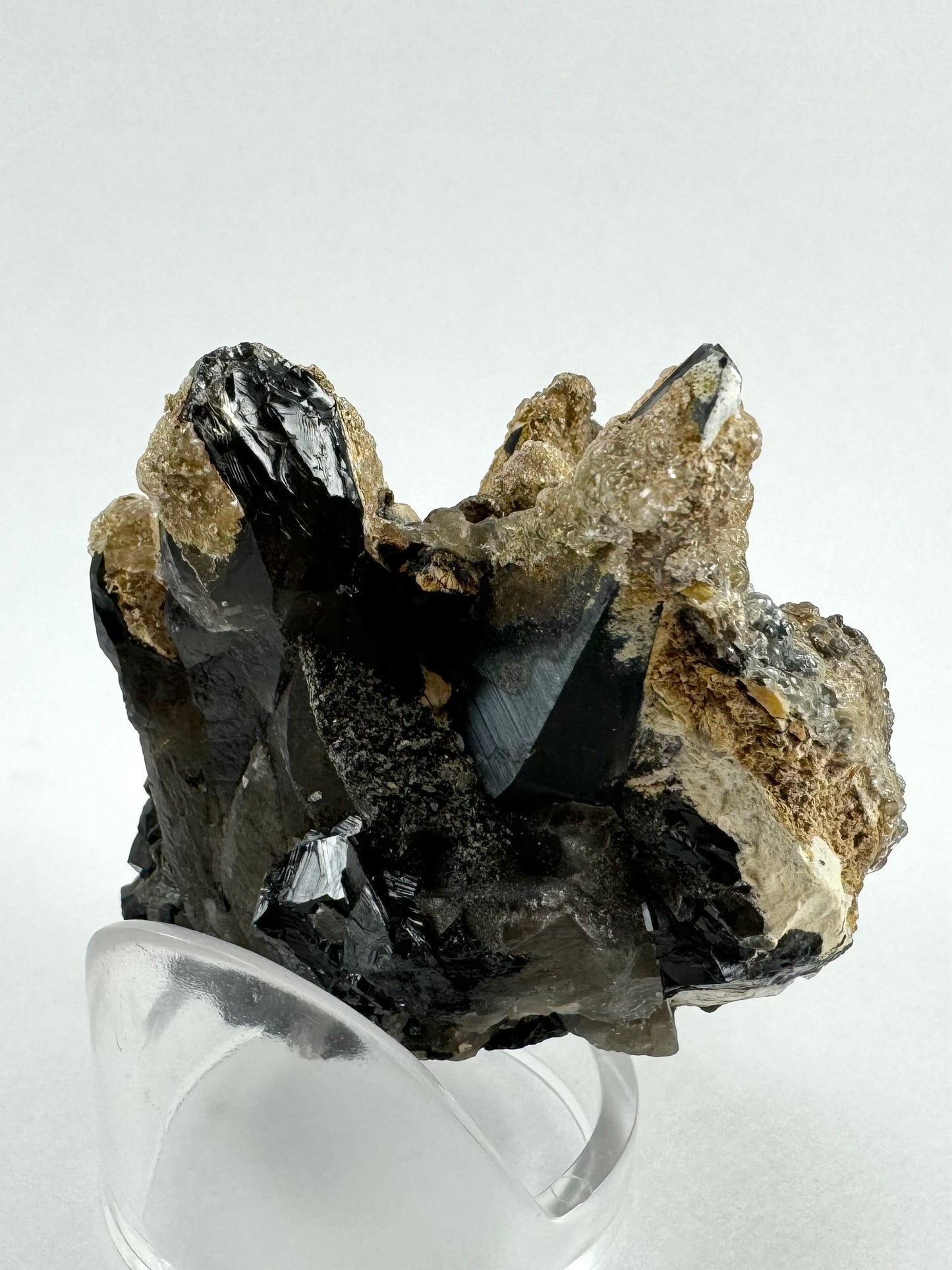 The back of the specimen, a bit messy with broken and irregular crystals of smoky quartz and schorl.