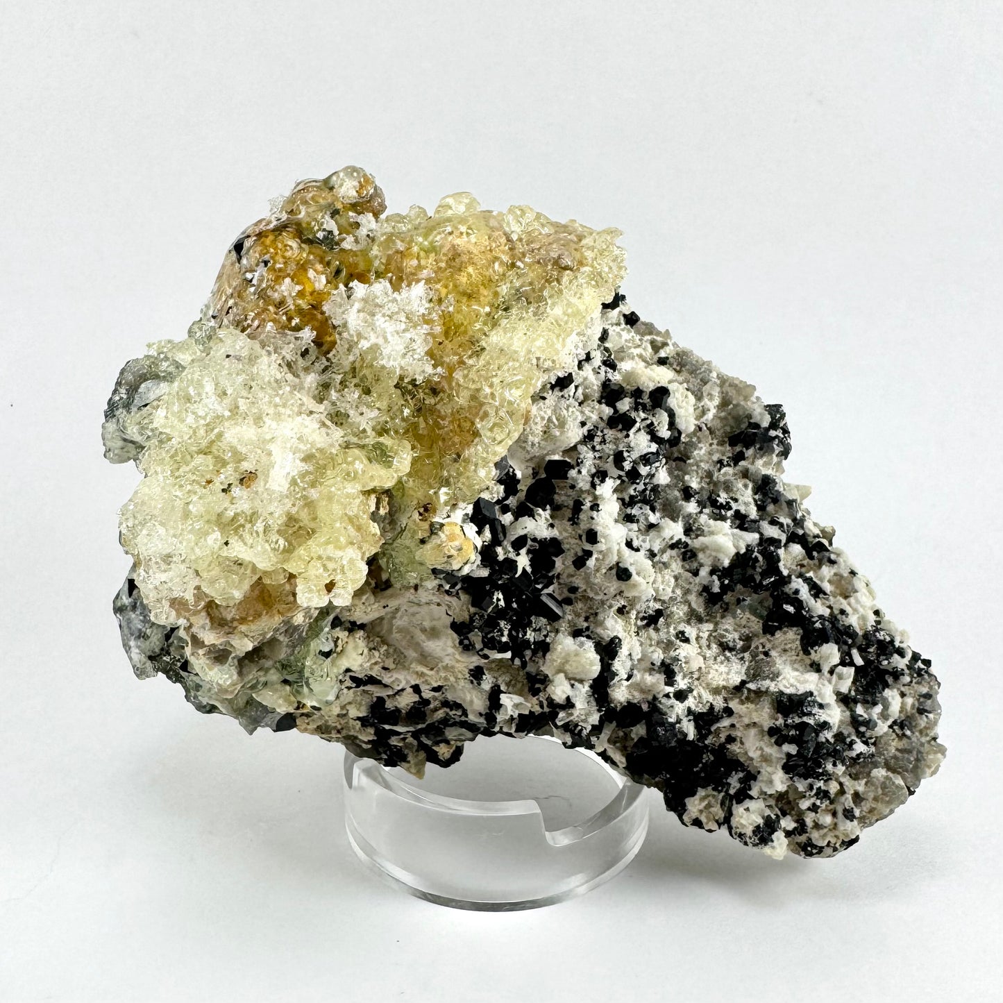 Black tourmaline in albite matrix with hyalite and minor fluorite