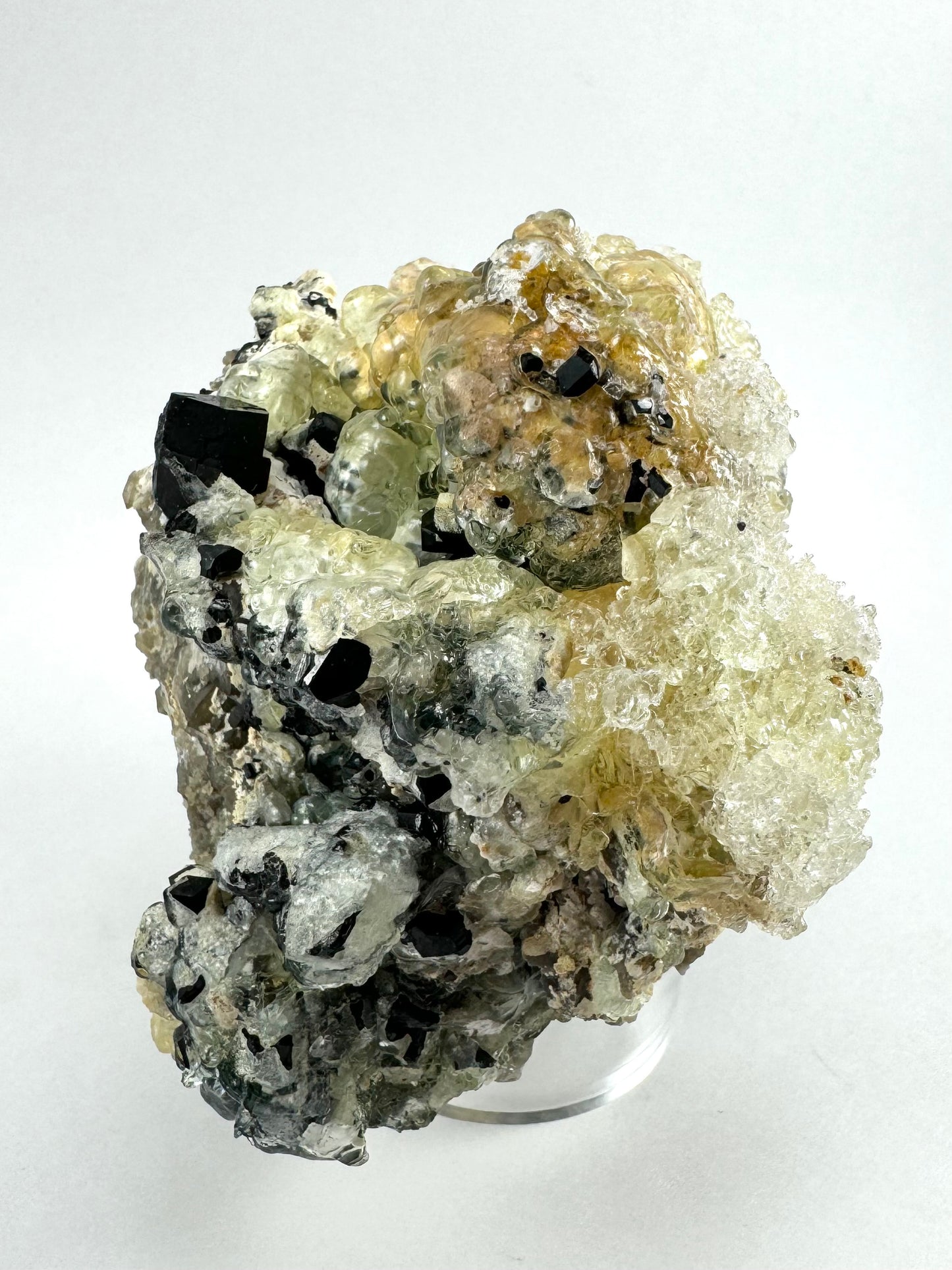 Black tourmaline in albite matrix with hyalite and minor fluorite